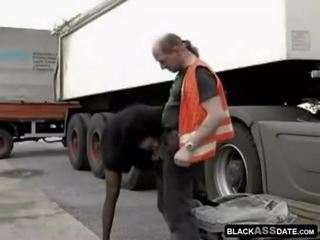 Black hooker riding on mature truck driver outside